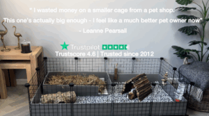 Spacious C&C guinea pig cage with fleece liner and hay tray, featuring a customer testimonial and Trustpilot rating.